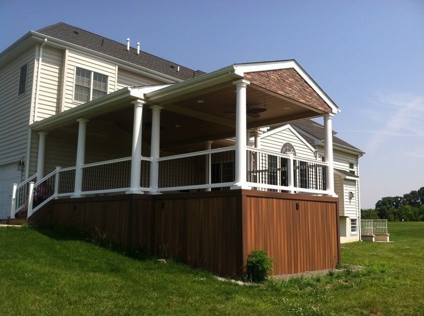 this cedar pergola was installed on a front entrance to a